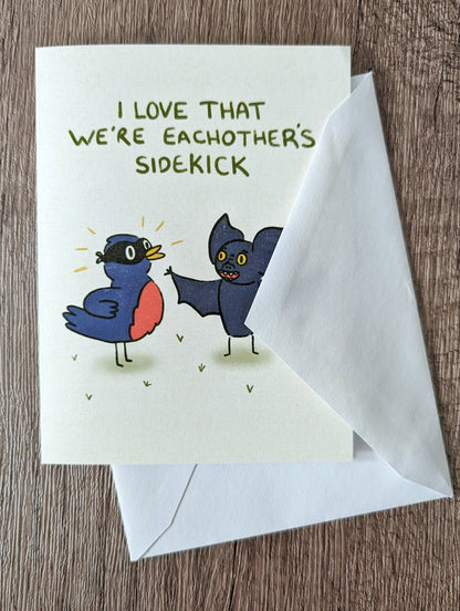 We're Each Other's Sidekick - Cute Romance Valentine Card: Brown (kraft) self seal envelope / Clear plastic cellophane packaging