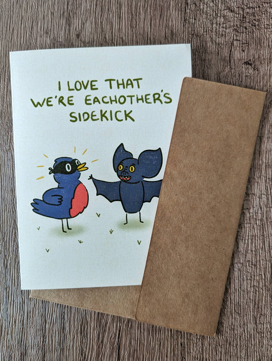 We're Each Other's Sidekick - Cute Romance Valentine Card: Brown (kraft) self seal envelope / Clear plastic cellophane packaging
